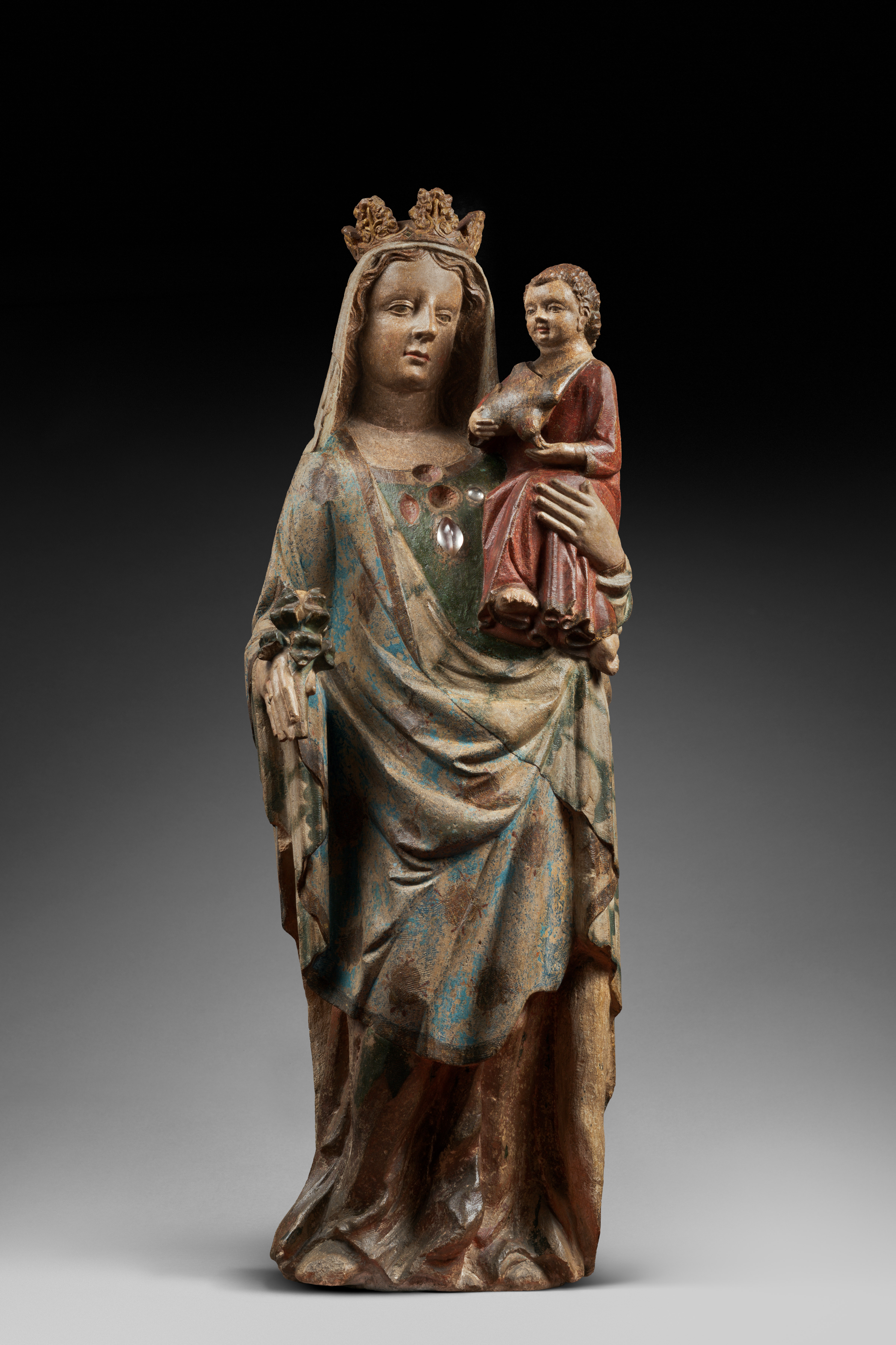 Important 14th century polychrome limestone Virgin from Lorraine
