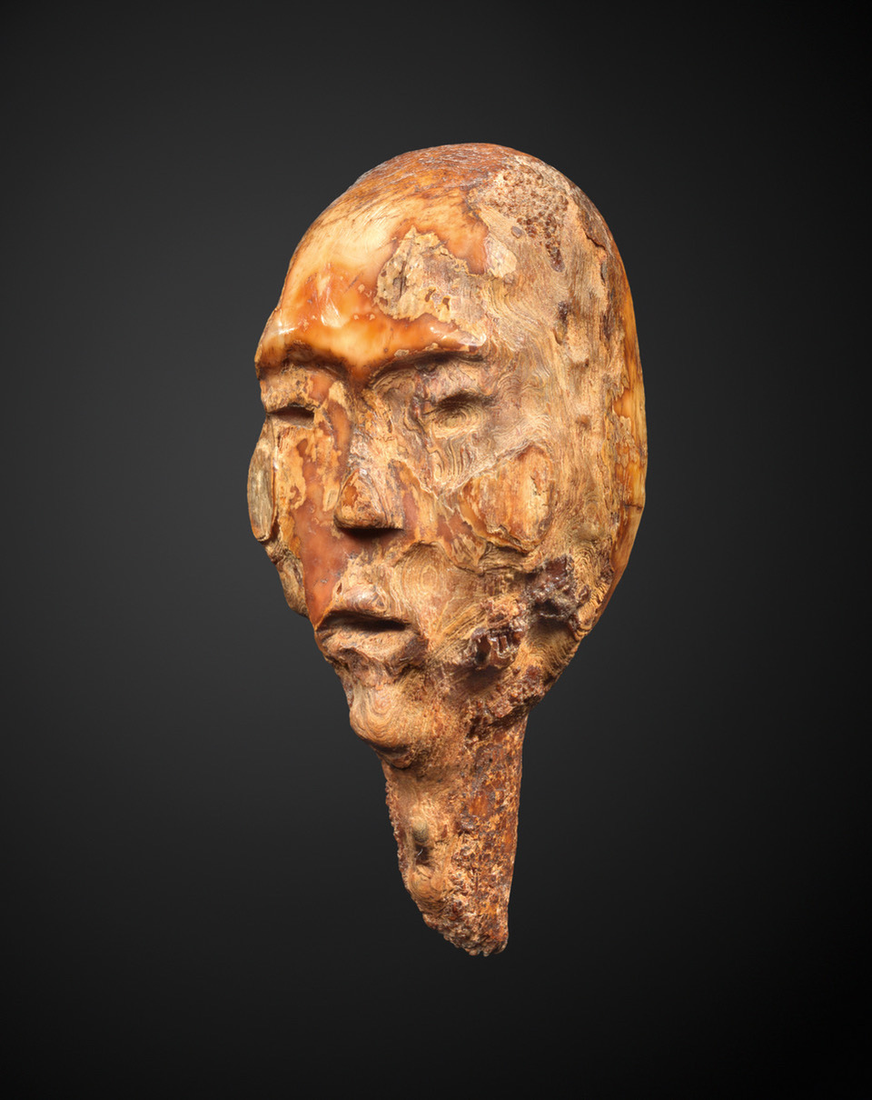 Massive head from an archaic shamanic figure.